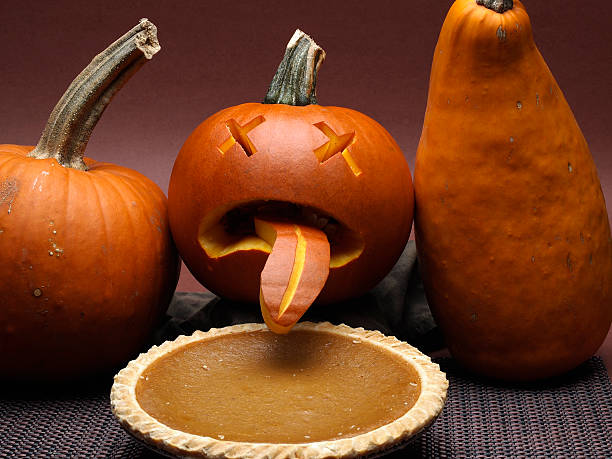 Sick Jack-0-Lantern "Pumpkin sickened by pumpkin pie. Could represent poor quality frozen pie, cannabalism or just funny." pumpkin throwing up stock pictures, royalty-free photos & images