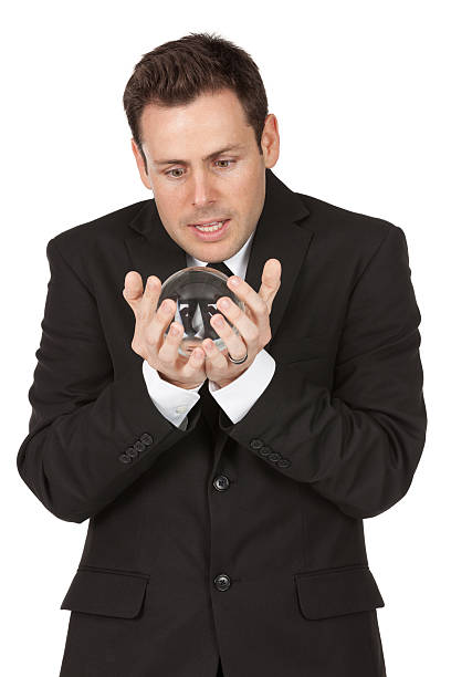 istock Businessman holding a crystal ball 184973339