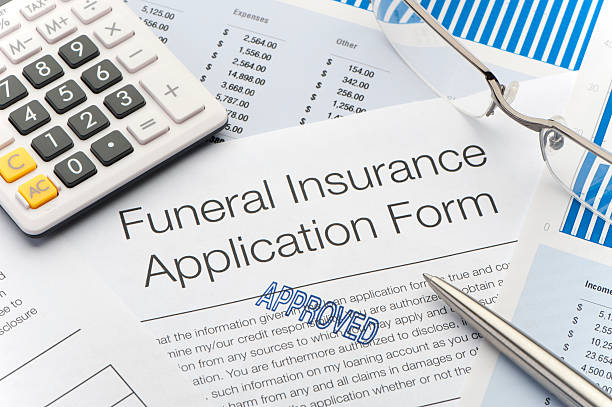 istock Close up of approved Funeral Insurance application 184973570