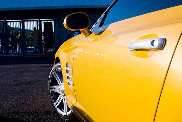 istock yellow sports car with allow wheel 184973689