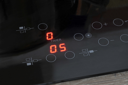 Detail of the control system of an induction hob