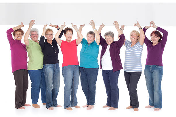 istock group of senior women holding board 184973952