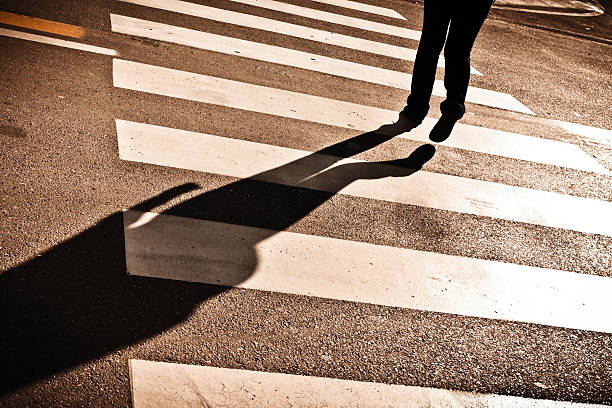 istock Solitary Shadow Crossing the Street 184974056
