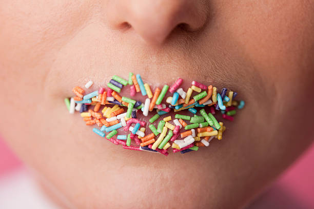 istock woman with candies lipstick 184974270