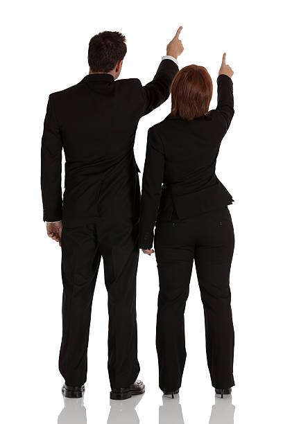 istock Rear view of a business couple pointing 184974563