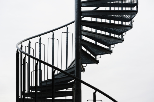 Metal staircase in silhouette.