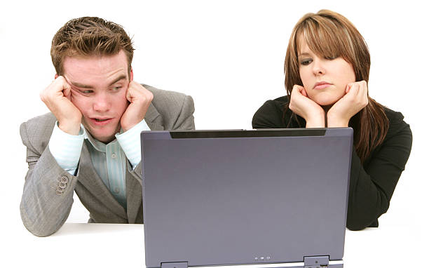 istock Two business associates looking frustrated at a laptop 184974796