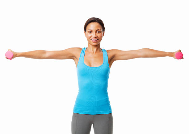 Portrait of a young woman standing in t-pose holding hand weights. Horizontal shot. Isolated on white.