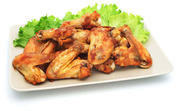 istock Chicken wings with salad on plate - isolated 184975162