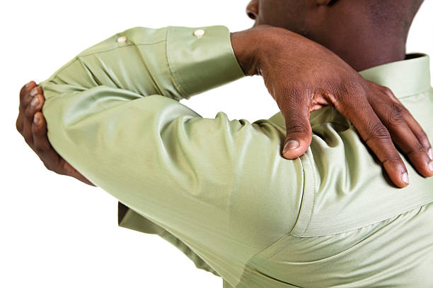 Man massaging his elbow in pain