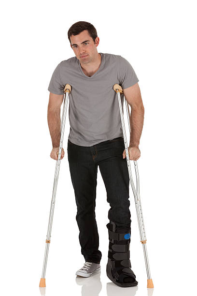 istock Injured young man on crutches 184975996