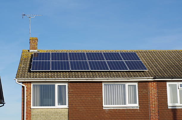 istock Solar Panels on 1970s type England House 184976065