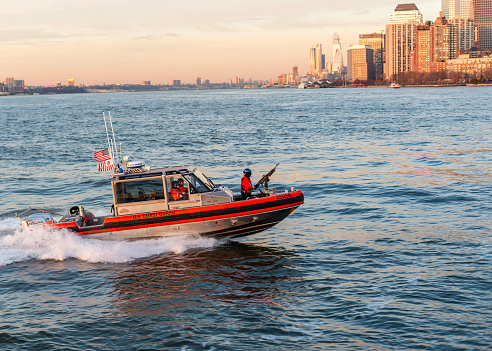 New York City, NY, USA - December 19, 2018: The US Coast Guard patrols the waters of New York City.