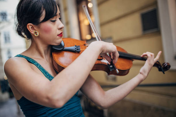 istock Violinist playing violin on the street 1849763933
