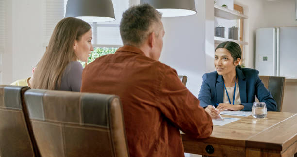istock Couple talking with insurance agent 1849766763