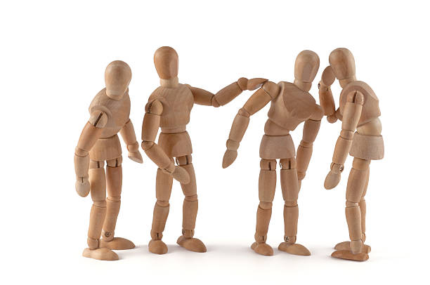 istock Rumors - wooden mannequin wispering 184976686