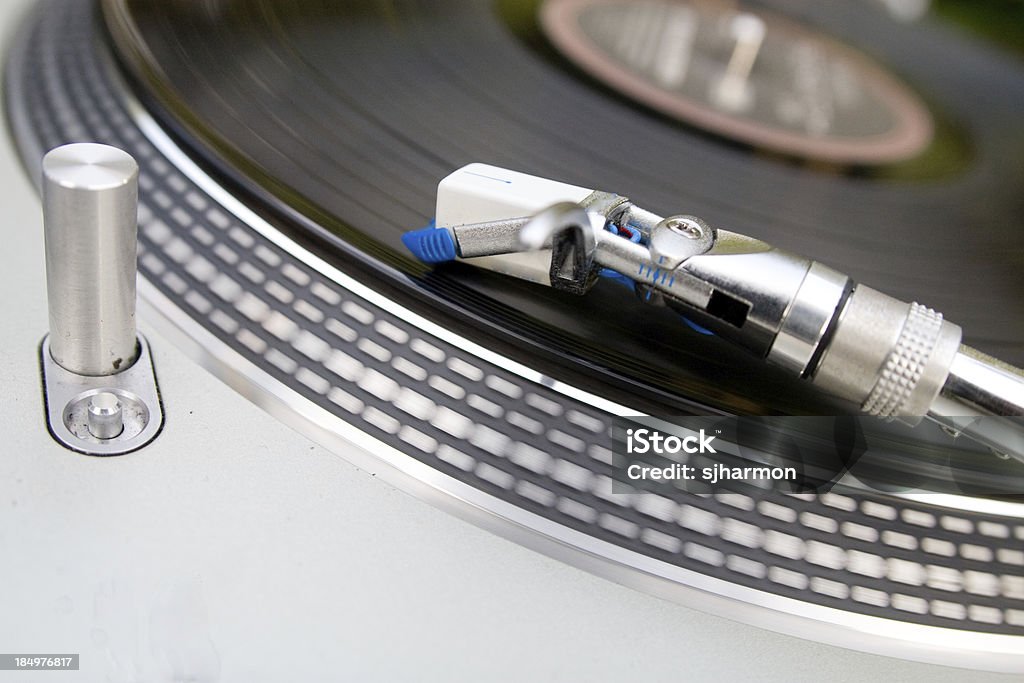 Record player with focus on the head  &amp; vinyl Record player with focus on the head of the player 1960-1969 Stock Photo