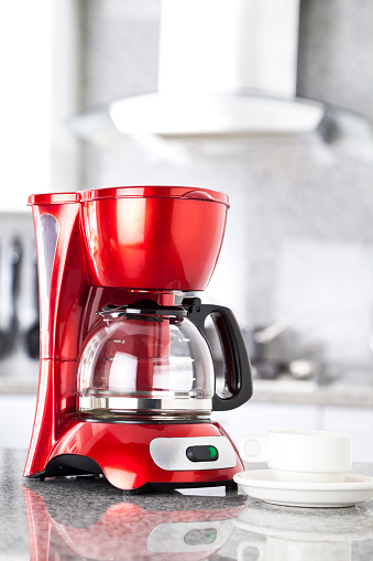 Red Coffee Maker on Kitchen Counter Top .  MORE RED HOUSEHOLD APPLIANCES ON MY POTRFOLIOhttp://i1215.photobucket.com/albums/cc503/carlosgawronski/HouseholdAppliances.jpg