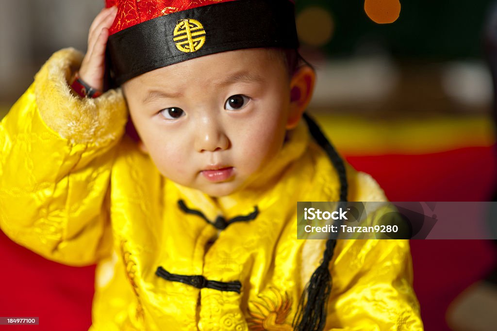 Baby boy in traditional Chinese dress Baby boy in traditional Chinese dress for holiday season Baby - Human Age Stock Photo