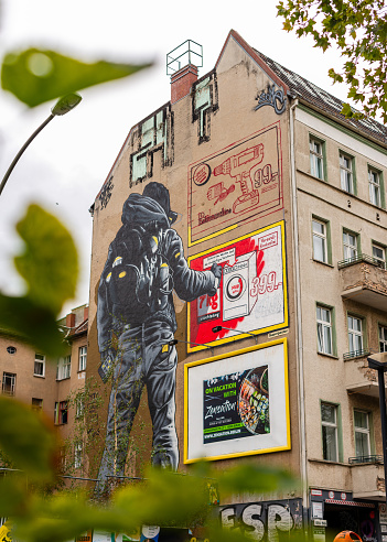 Berlin, Germany - October 08, 2020: Graffiti and street art on the side of a building in Friedrichshain, Berlin.