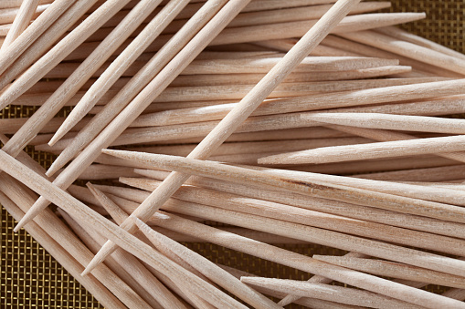 Toothpicks photographed on  sieve