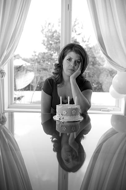 istock sad alone women on birthday 184977447