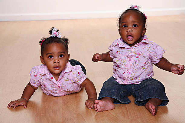 Baby Twin Girls stock photo