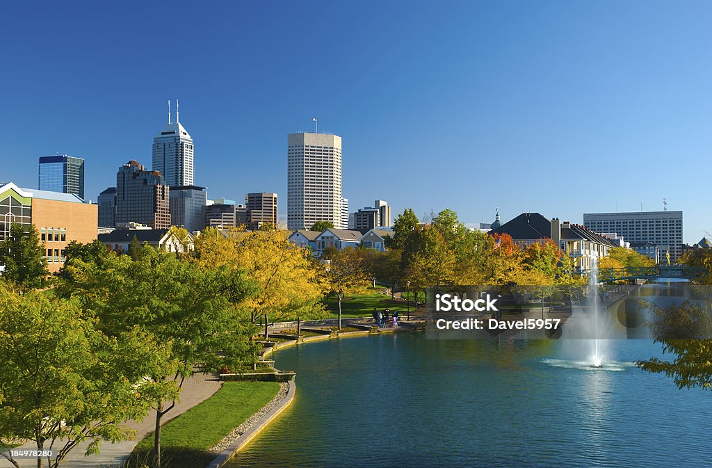 View of Indianapolis skyline and Canal Walk Indianapolis skyline in the distance with houses and the Indiana Central Canal / Canal Walk in the foreground. Indianapolis Stock Photo