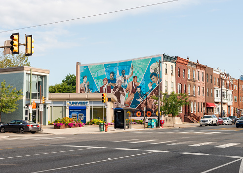 Philadelphia, PA, USA - August 26, 2017: Downtown Philadelphia building with street art on one side.