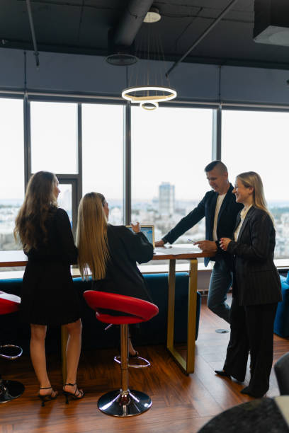 istock Smiling employees consider project to promote company 1849787286
