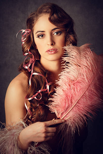 istock retro girl with feather fan 184979261