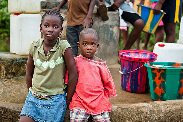istock African Children by Water Pump 184979403