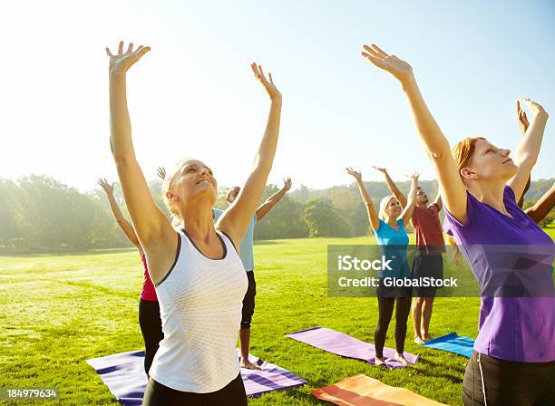 Reaching For Good Health Yoga Stock Photo - Download Image Now - 20-29 Years, 30-39 Years, Active Lifestyle