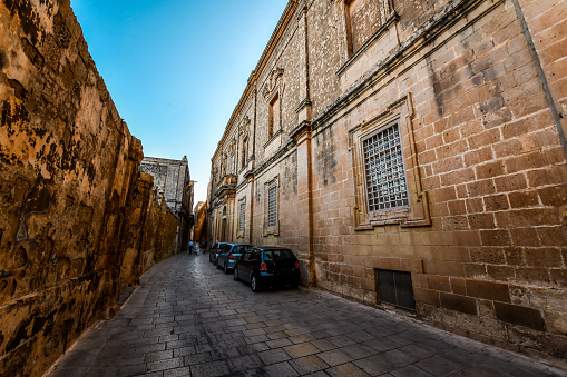 Cars Parked On Archbishop's Square Near St. Paul's Cathedral In Mdina, Malta