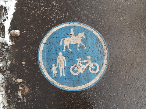 Shared road for equestrians, pedestrians and cyclists road sign at a public park in Glasgow Scotland England UK