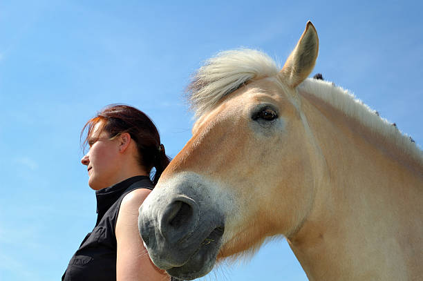istock woman with horse 184981053