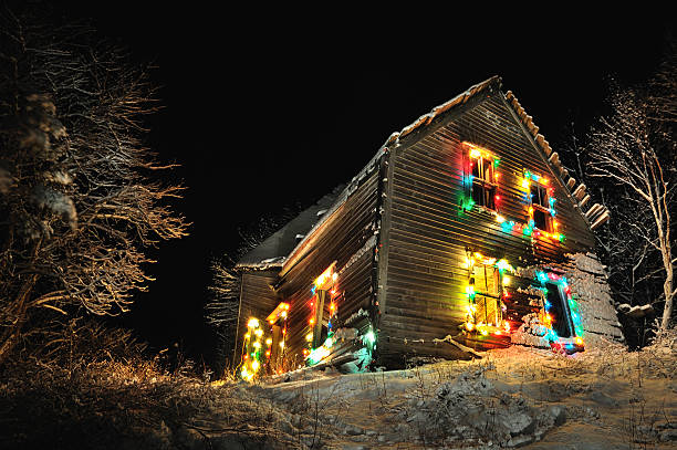 Spooky Abandoned House with Christmas Lights, Nova Scotia "This abandoned house in Nova Scotia was decorated with Christmas lights powered by a generator.  Spotlights were used to light-paint the trees and the foreground, and to fill in shadows on the house.  Also a lamp was placed in a room in the house.More of my images of abandoned houses and buildings can be found here:" creighton stock pictures, royalty-free photos & images