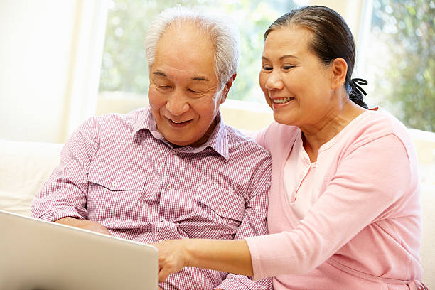 istock Senior Asian couple using laptop 184982260