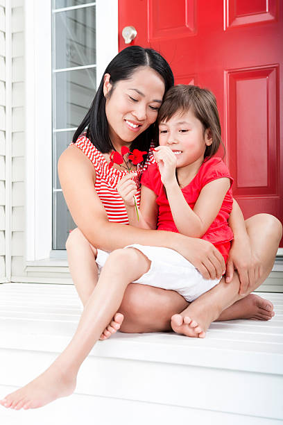istock Mother and daughter looking at flowers 184982477