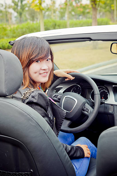 istock asian woman driving 184982504