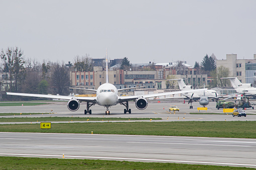 Aerial view of an airport terminal with turbo prop aircraft.