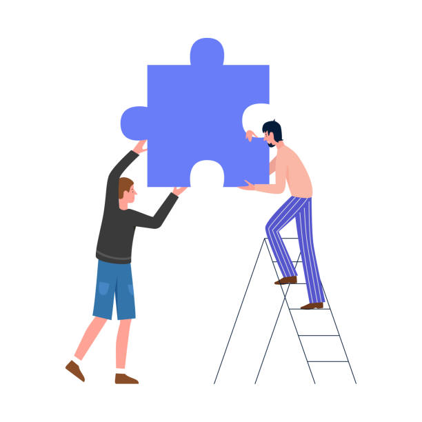 istock Male characters holding puzzle piece together, tiny man standing on ladder to help 1849825301
