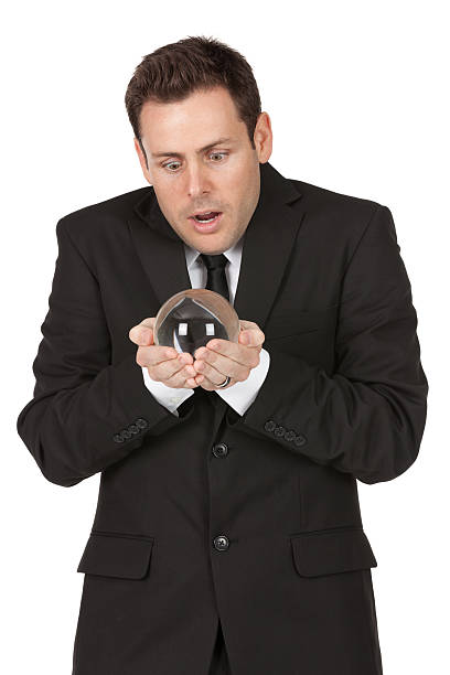 istock Businessman holding a crystal ball 184982931