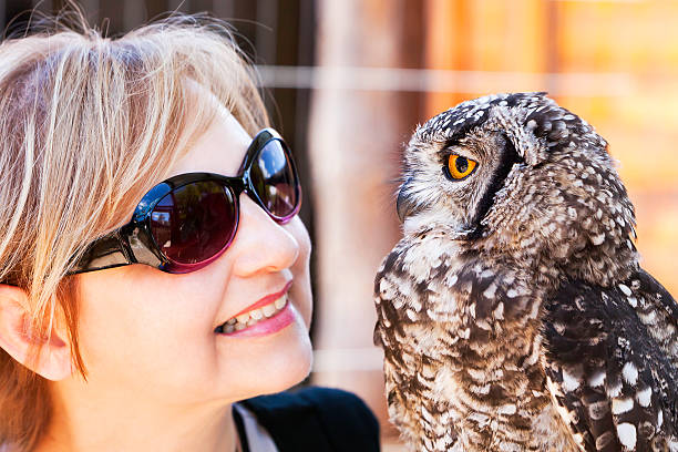 istock Looking at each other a Lady and an Owl 184983280