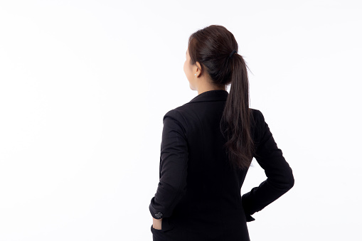 Portrait beautiful businesswoman in suit standing isolated on white background, young asian business woman is manager or executive with confident is positive and success, back view.