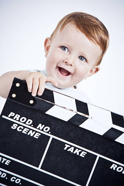 Adorable baby cinema director.