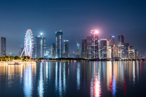 The futuristic towers of Marina Bay Sands illuminated at night, Singapore.