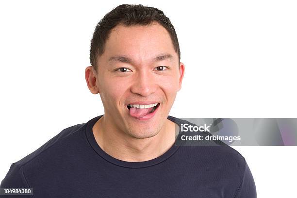 Silly Asian Man Sticking Out Tongue Stock Photo - Download Image Now - Men, Navy Blue, T-Shirt