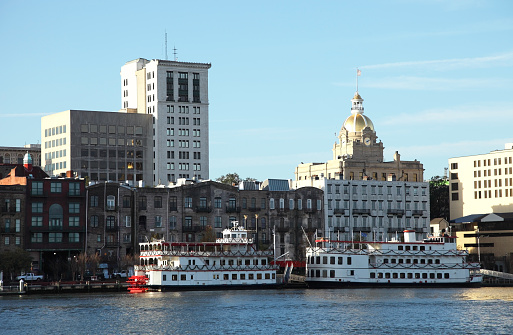 Downtown Savannah, Georgia skyline along the banks of the Savannah River. Savannah is the oldest city in the U.S. state of Georgia and largest in Chatham County. Savannah is known for its southern charm, antebellum homes, swamps and oak trees dripping with Spanish moss.