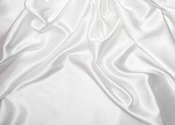 delicate waves of satin silk with copyspace in front